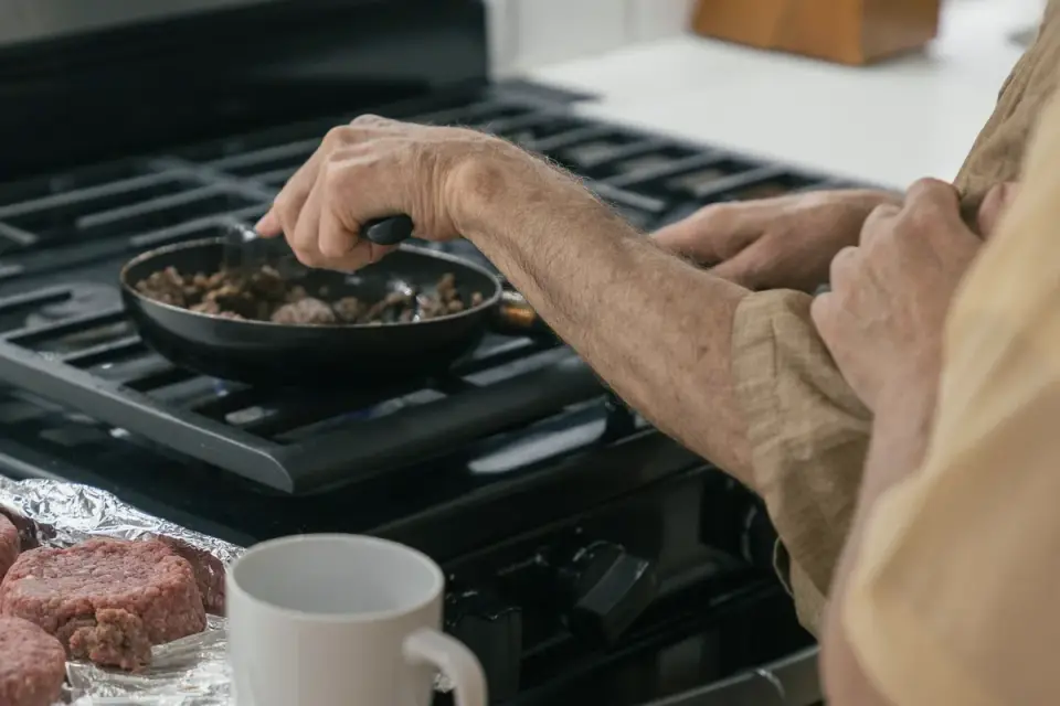 Dog owner preparing a meal